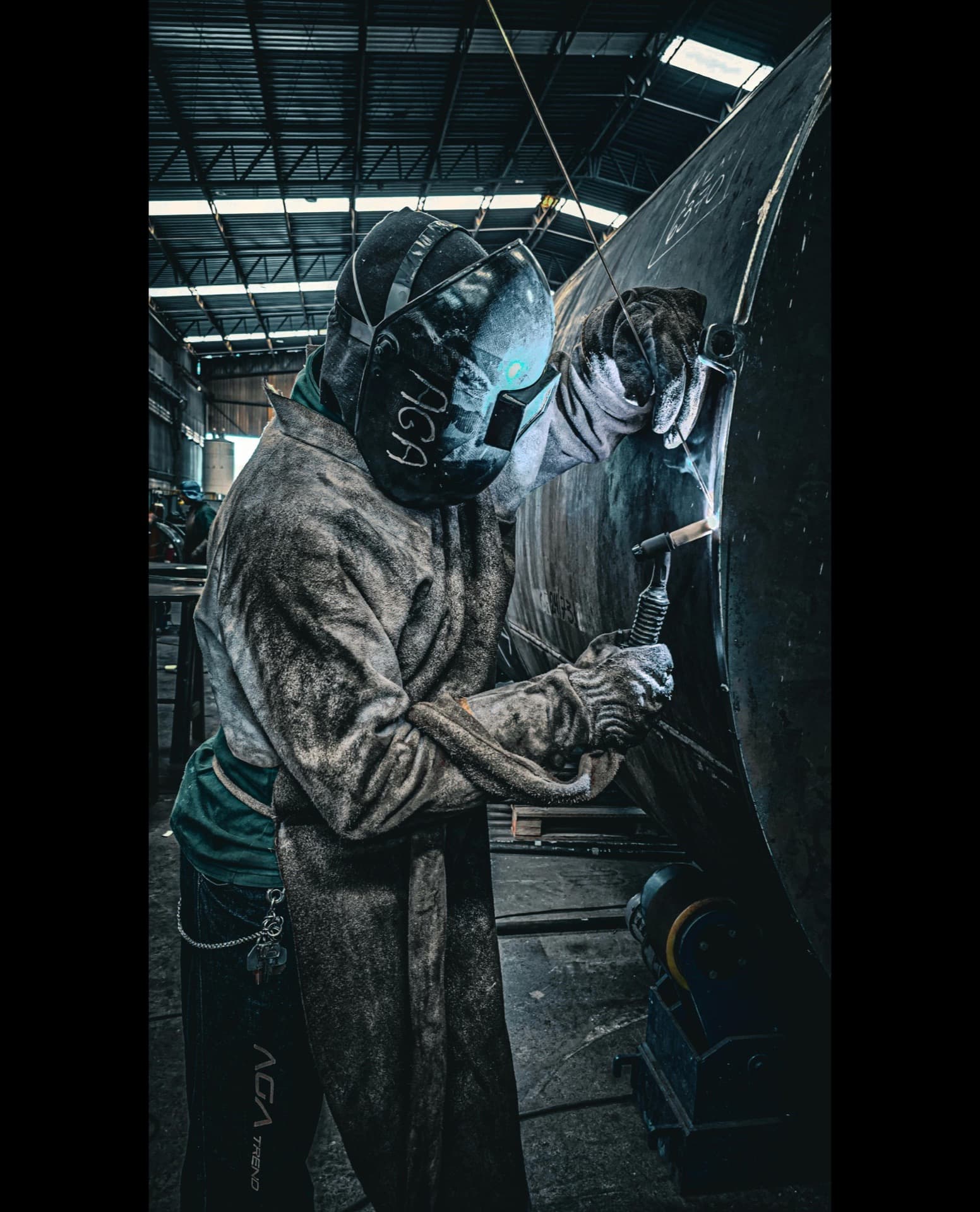 CSWIP welding inspector reviewing pipe welds during fabrication in a Saudi industrial workshop